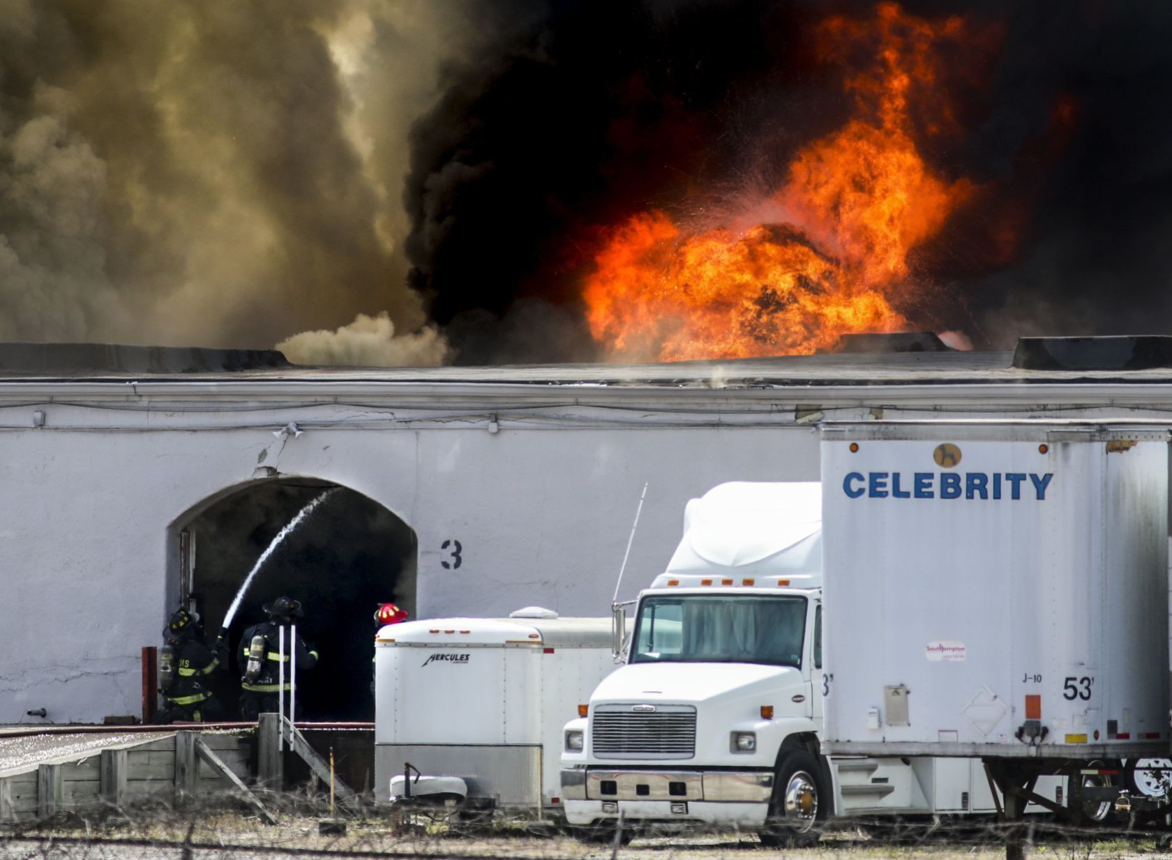 Large fire rolls through warehouse